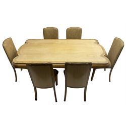 Early 20th century Art Deco walnut twin pedestal dining table, shaped top with thick crossbanding over a rounded edge, raised on two shaped pedestals (W187cm D107cm H76cm); and set of six matching dining chairs, the high back and sprung drop-in seat upholstered in walnut effect faux leather with reeded apron, raised on square supports (W47cm H97cm)