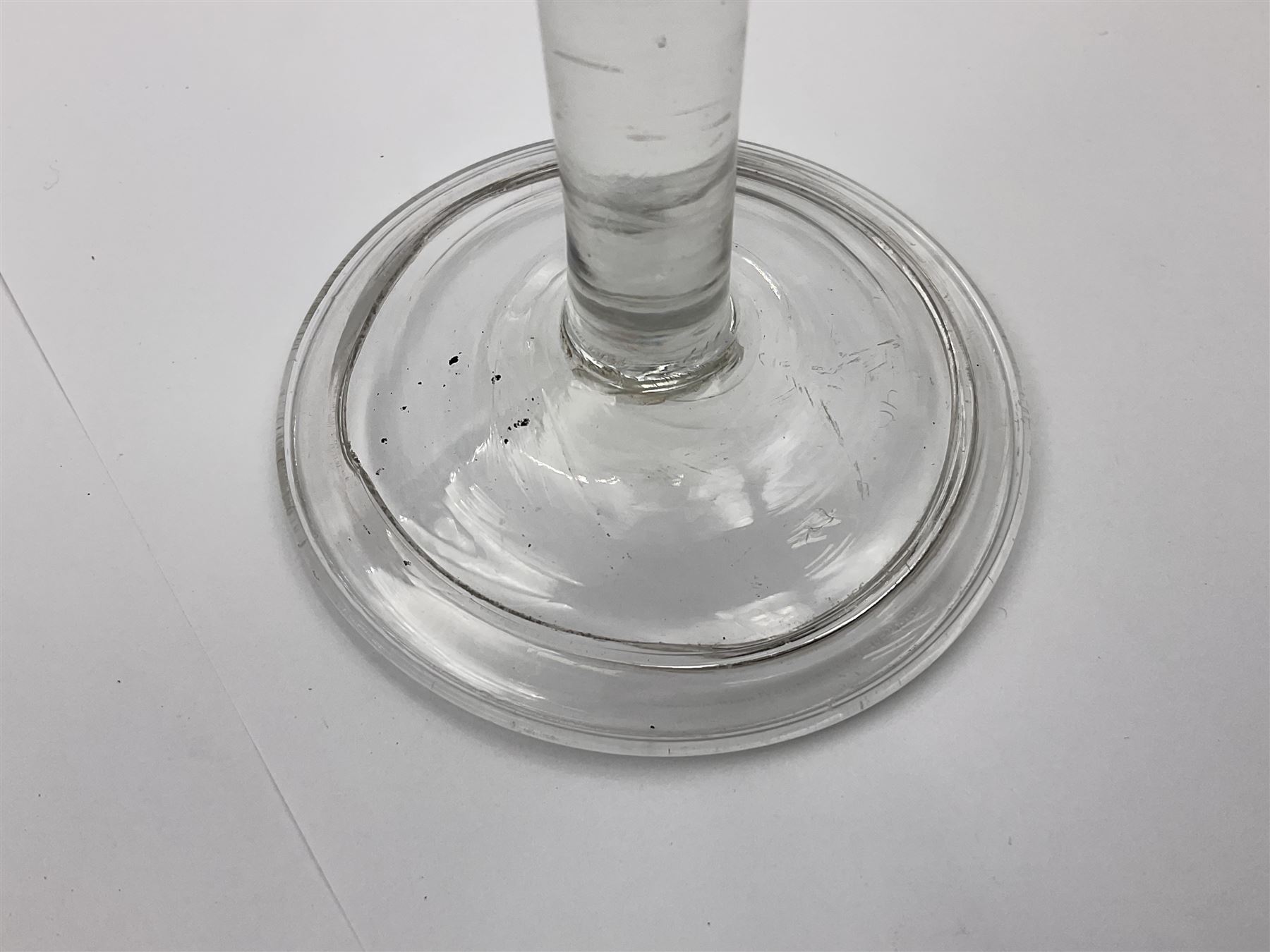 18th century wine glass, the trumpet shaped bowl upon tear drop stem and conical folded foot, H15.5cm, together with an 18th century cordial glass, the round funnel bowl on plain knopped stem and folded conical foot