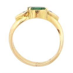 14ct gold emerald and diamond three stone ring, oval cut emerald with a round brilliant cut diamond set either side, to a wave design shank