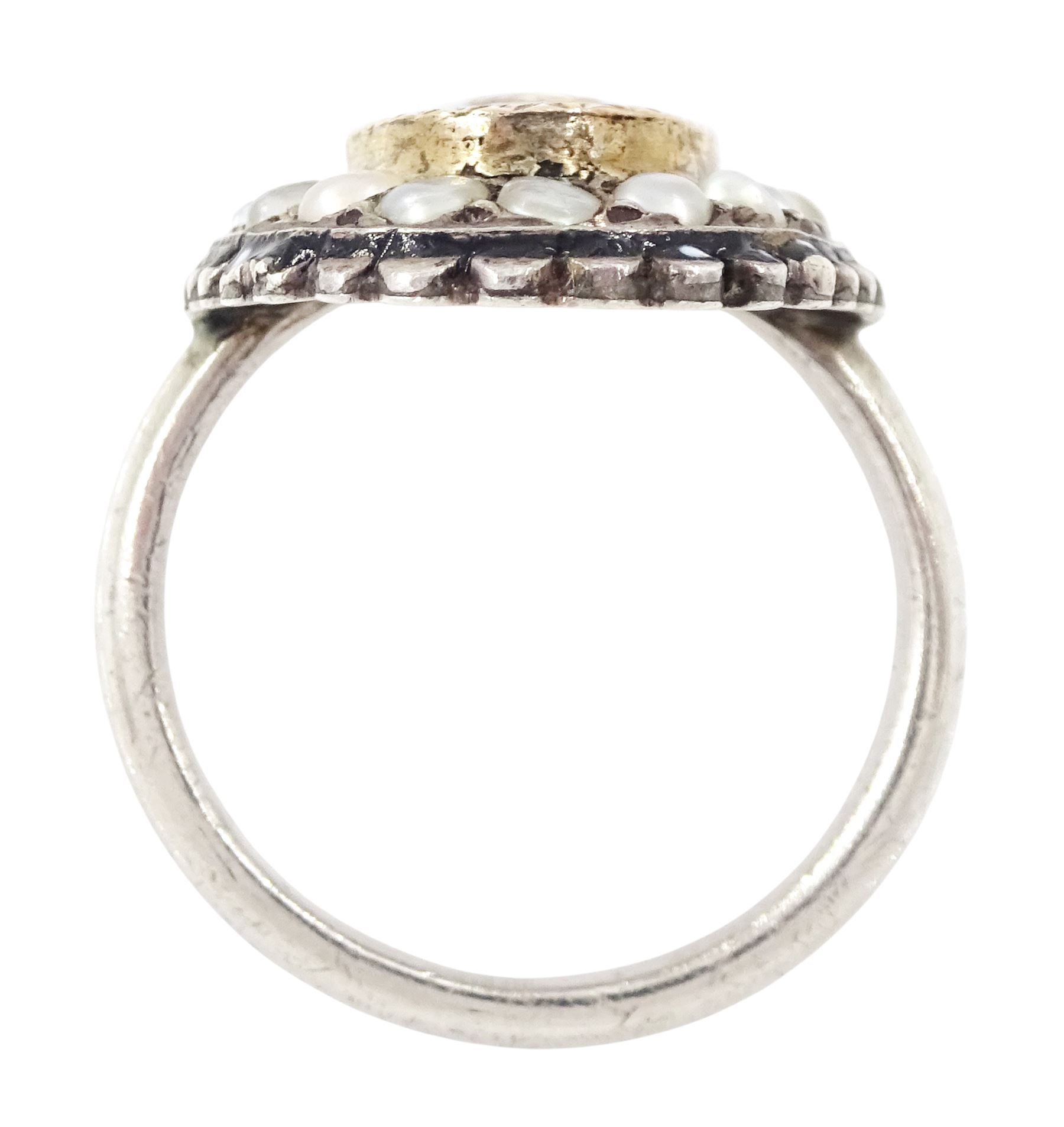 19th century French silver enamel portrait ring, set with an oval hand painted panel of a cherub, with split pearl surround