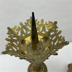 Pair of gilt metal pricket candlesticks, with applied decoration on knopt stems and triform bases, H47cm
