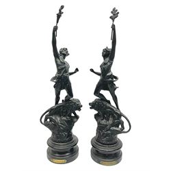 Pair of spelter figures, Le Force and Le Pouvoir, modeled as figures standing on lions, arms held aloft, H51cm 