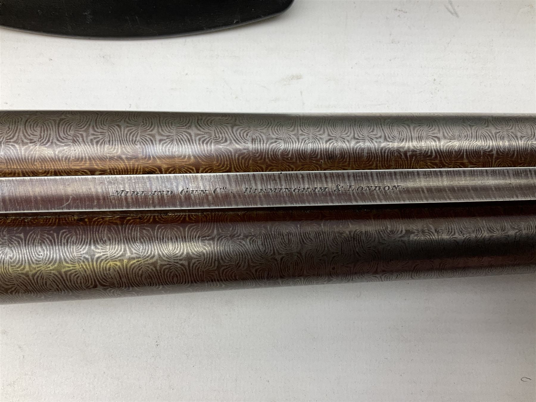 Midland Gun Company Birmingham & London 12-bore side-by-side box-lock non-ejector double barrel shotgun with 76cm damascus barrels, Prince of Wales style walnut stock with chequered grip and fore-end, top safety and engraved lock no.62160 L120cm overall; in scratch built baize lined wooden case. SHOTGUN CERTIFICATE REQUIRED.