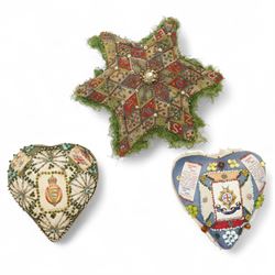 Victorian sweetheart pin cushion in the form of a star 'Forget Me Not, from Warley Barracks' 1889, a WWI heart shape cushion 'Essex Regiment' and another 'Royal Sussex Regiment' (3)