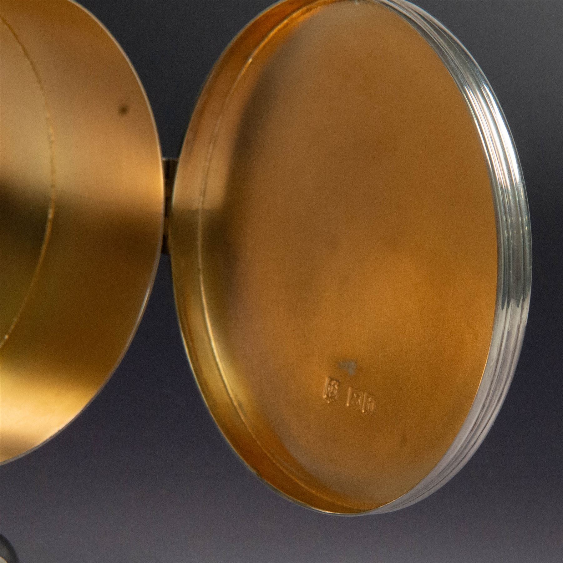 Late Victorian silver lunette, of plain circular form with hinged cover opening to reveal gilt interior, upon a circular domed foot, hallmarked Lambert & Co, London 1897, H13cm