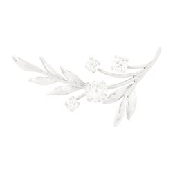 18ct white gold diamond flower brooch, set with a principal old cut diamond of approx 1.00...