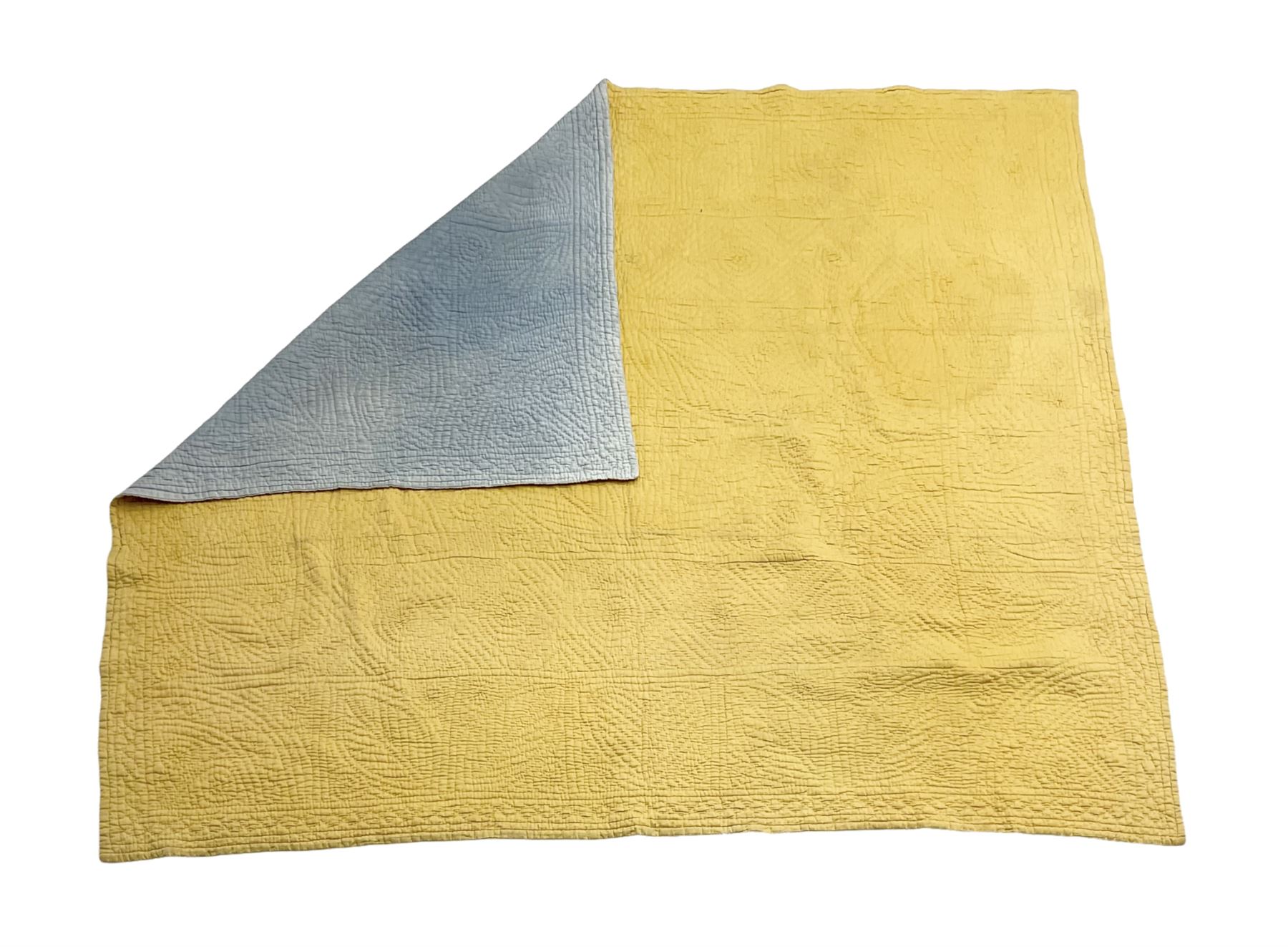 Early 20th century Welsh whole cloth sky blue quilt, in traditional quilting patterns, supported on yellow coloured backing, 174cm x 204cm