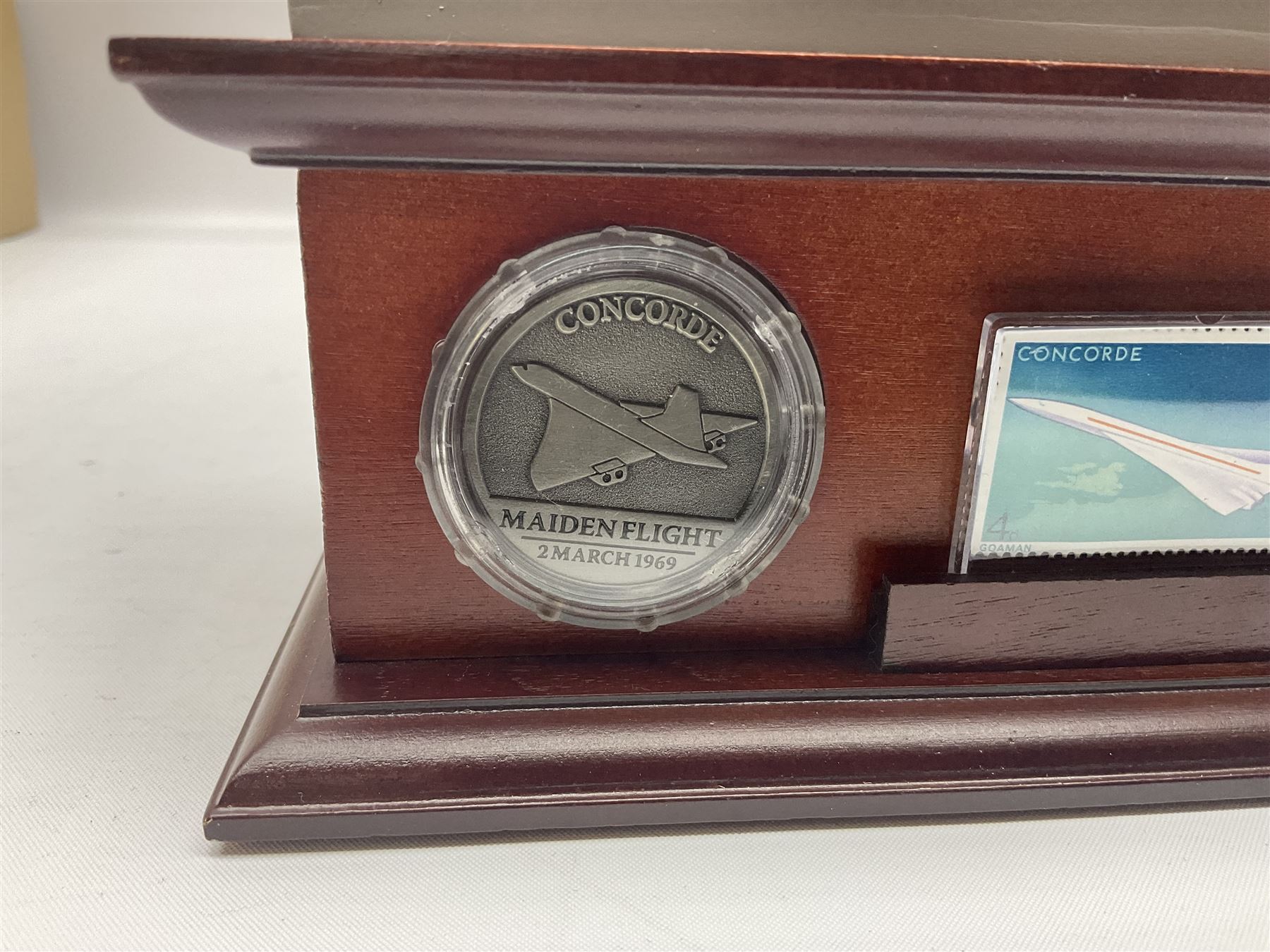 Danbury Mint 'The Ultimate James Bond Collection' comprising stamps and coins housed in a display case, 'Concorde Queen of the Skies' sculpture, stamps, medallion display and 2020 'Centenary of the Unknown Warrior' five pound coin cover in Harrington and Byrne folder