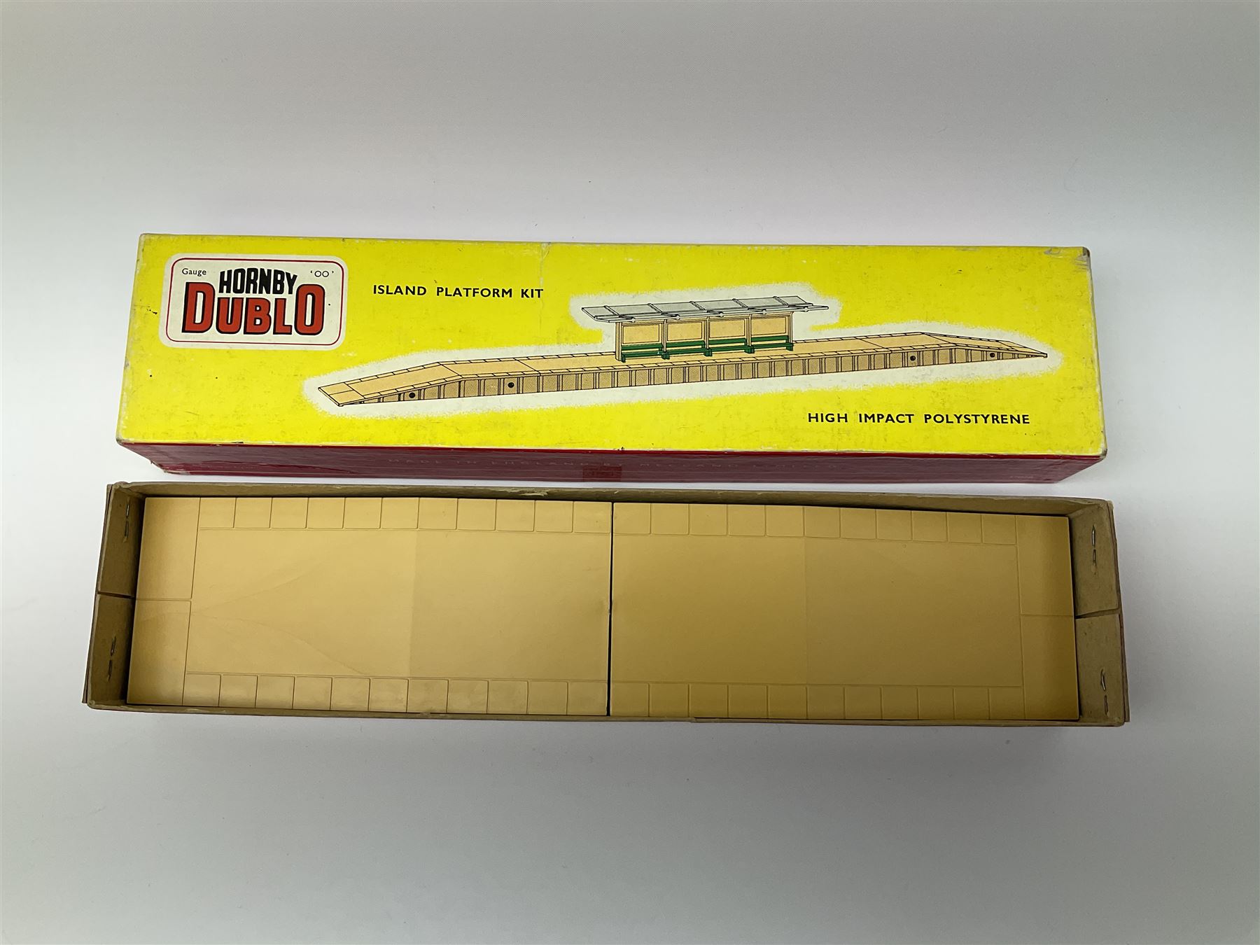 Hornby Dublo - 5006 Engine Shed Extension Kit; 5085 Suburban Station Kit; and 5030 Island Platform Kit; all in pictorial boxes; and Plastic Platform Extension in associated box lid (4)