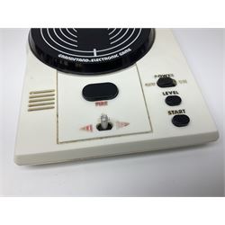 Three late 70s/early 80s handheld electronic games; Bandai Electronics Arcade ‘Gunfighter’ (1980), Grandstand ‘Invader From Space’ (1980), Palitoy ‘Merlin The Electronic Game Machine’ (1979) with game sheet and instruction booklet, all with original boxes (3) 