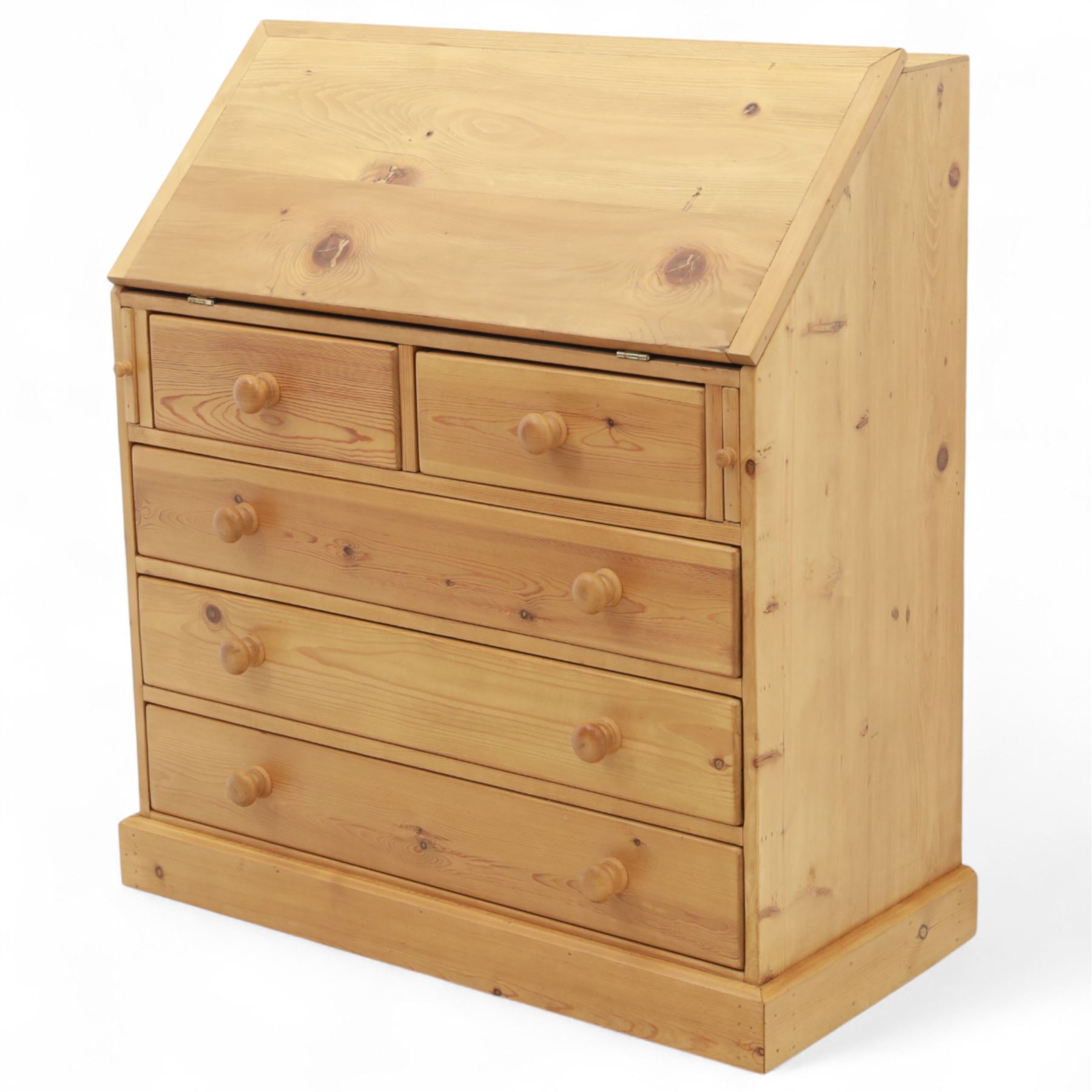 Contemporary waxed pine bureau, fall front enclosing fitted interior with pigeonholes and drawers, over two short and three long drawers with turned wooden knobs, on plinth base