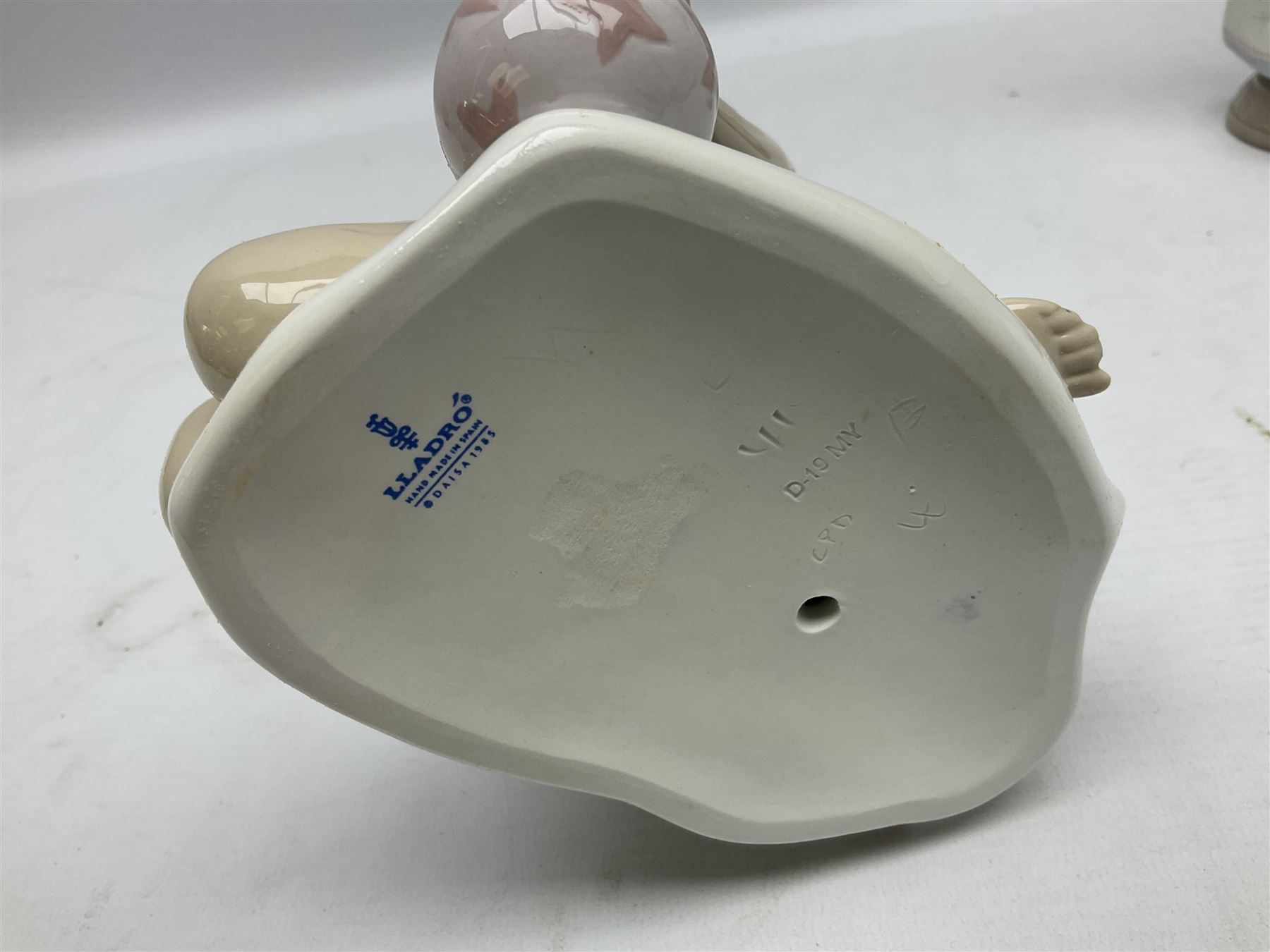 Three Lladro figures, comprising Modern Mother no 5873, Dropping the Flowers no 1285 and On the Beach no 1481, all with original boxes, largest example H30cm