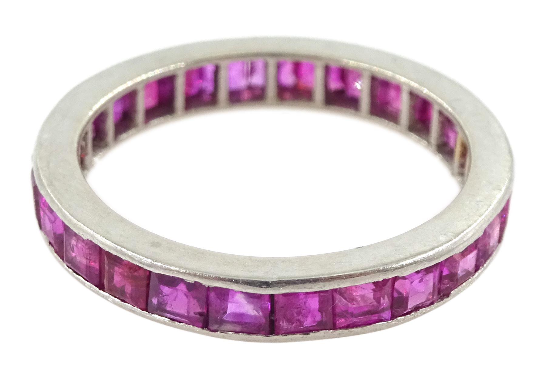 Platinum channel set, calibre cut ruby full eternity ring  