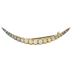 Early 20th century 18ct gold graduating opal crescent brooch