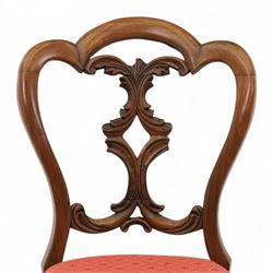 Set of four Victorian walnut balloon back chairs, with a carved and pierced back splat with foliate scrolls, serpentine seat upholstered in a diamond pattern fabric, raised on cabriole legs 