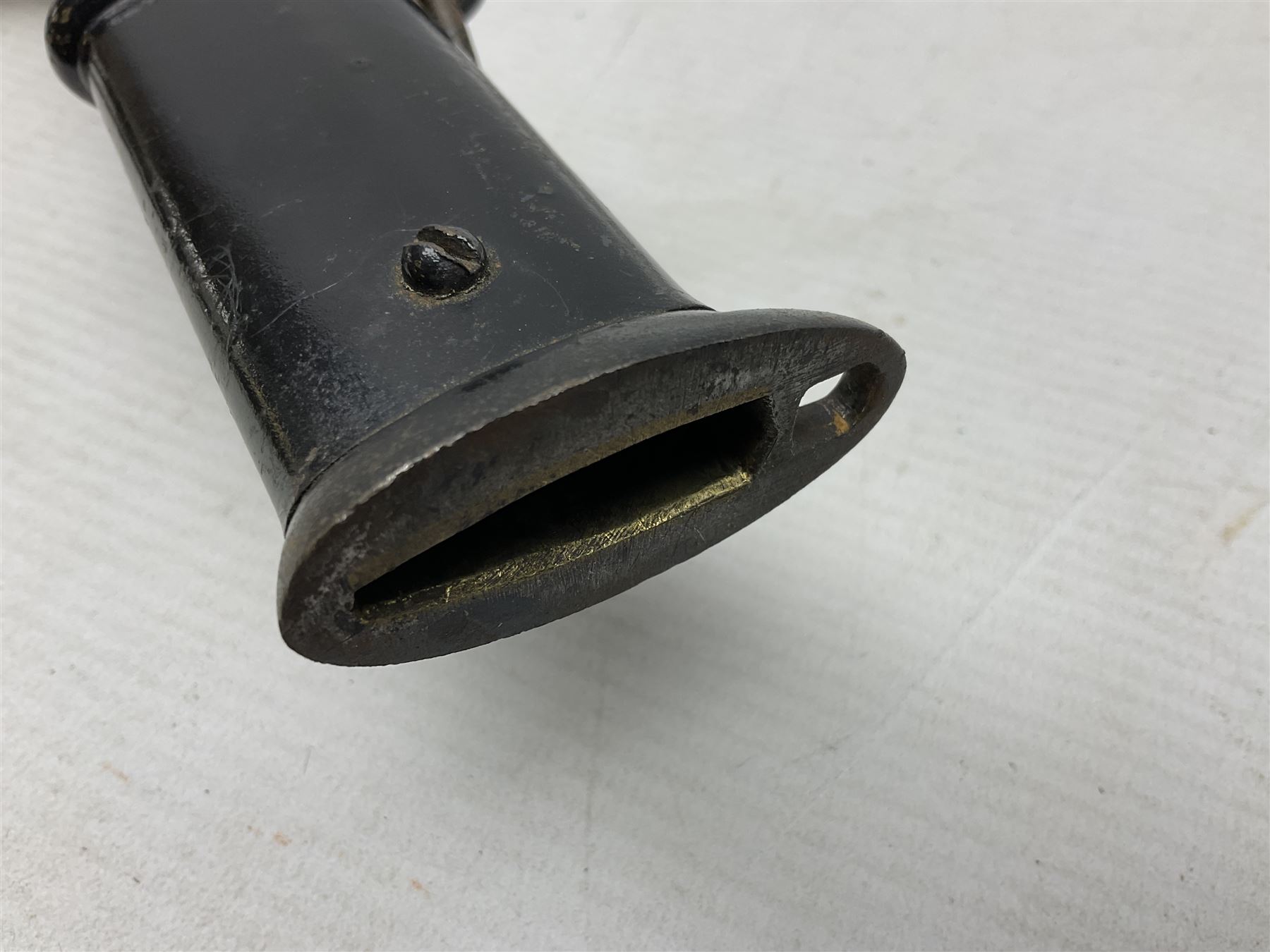 WW2 Japanese Army NCOs sword - katana, the 69.5cm slightly curving fullered blade numbered 14656; arsenal markings stamped near the habaki on the handle; brass tsuba and black painted metal hilt cast to simulate cord bound fish skin; in black painted steel scabbard with single suspension ring L96cm overall