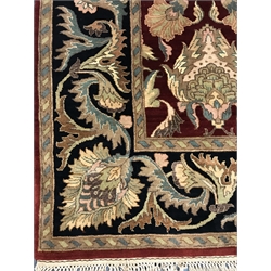 Persian style red ground rug, central field of stylised motifs, repeating border,  310cm x 250cm