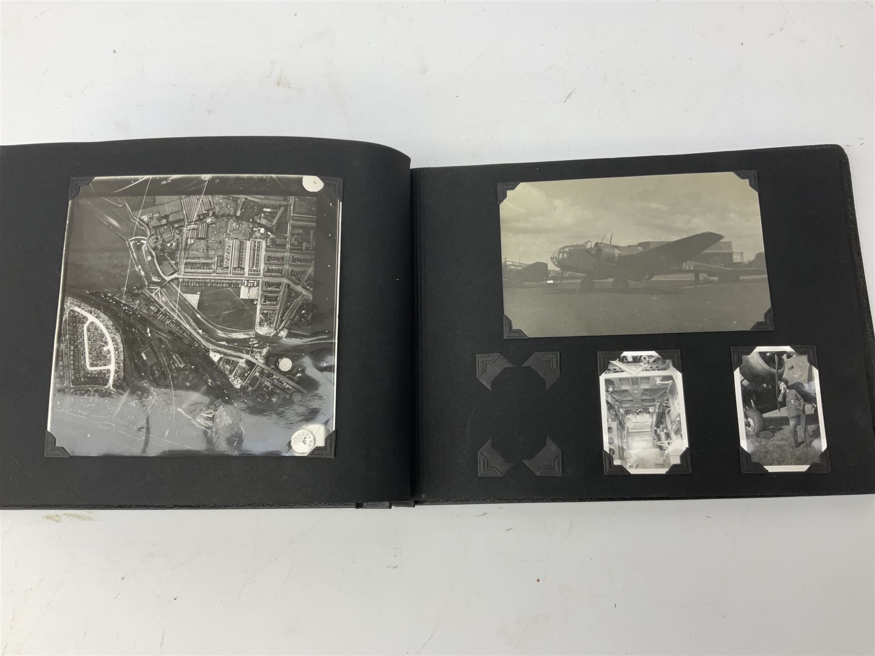 144 Squadron RAF - album containing over one hundred photographs and postcards of varying sizes including group shots, aircraft on the ground and in the air, German aircraft, crashes etc; sizes from 3.5 x 6cm to 16 x 21cm; and quantity of modern reference material
