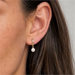 Pair of 9ct gold pearl pendant earrings, each stud set with a single white pearl, stamped 375