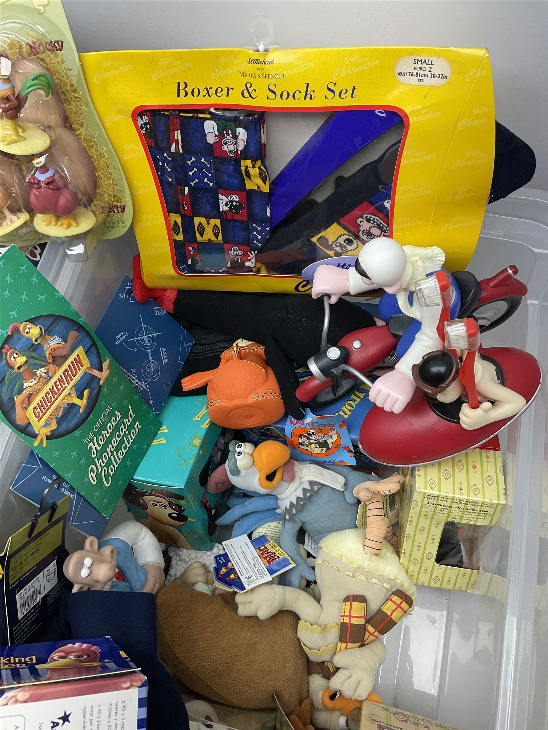 Quantity of Wallace and Gromit toys, accessories and memorabilia including soft toys, figurines, electronic ‘Talking Wallace’, car screen shades, and a quantity of Chicken Run Related merchandise, in three boxes
