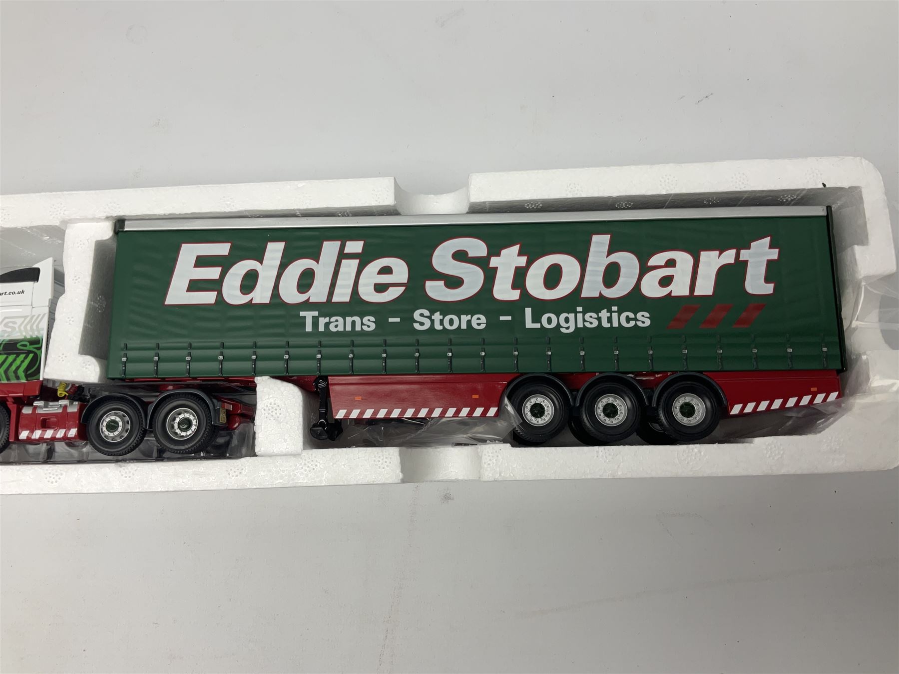 Corgi Eddie Stobart - three limited edition lorries; two Hauliers of Renown - CC13415 MAN TGA XXL Curtainside and CC14002 Volvo FH Curtainside; and  CC12607 Scammell Crusader Tautliner; all boxed (3)