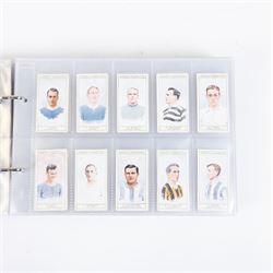 Collection of Edwardian and later Football related trading and cigarette cards, including forty-nine of fifty 1906 Ogden's Football Club Colours, 1922 PALS Footall series, ninety of one hundred 1925 Gallaher Famous Footballers, complete set of forty-four 1926 Ogden's Captains of Association Football Clubs and Colours, complete set of fifty 1927 Players Football Caricatures by MAC,  complete set of fifty 1927 Players Football Caricatures by RIP,  complete set of fifty 1930 Players Association Cup Winners, complete set of 50 1933 Ogdens AFC Nicknames etc, housed in brown cigarette card album