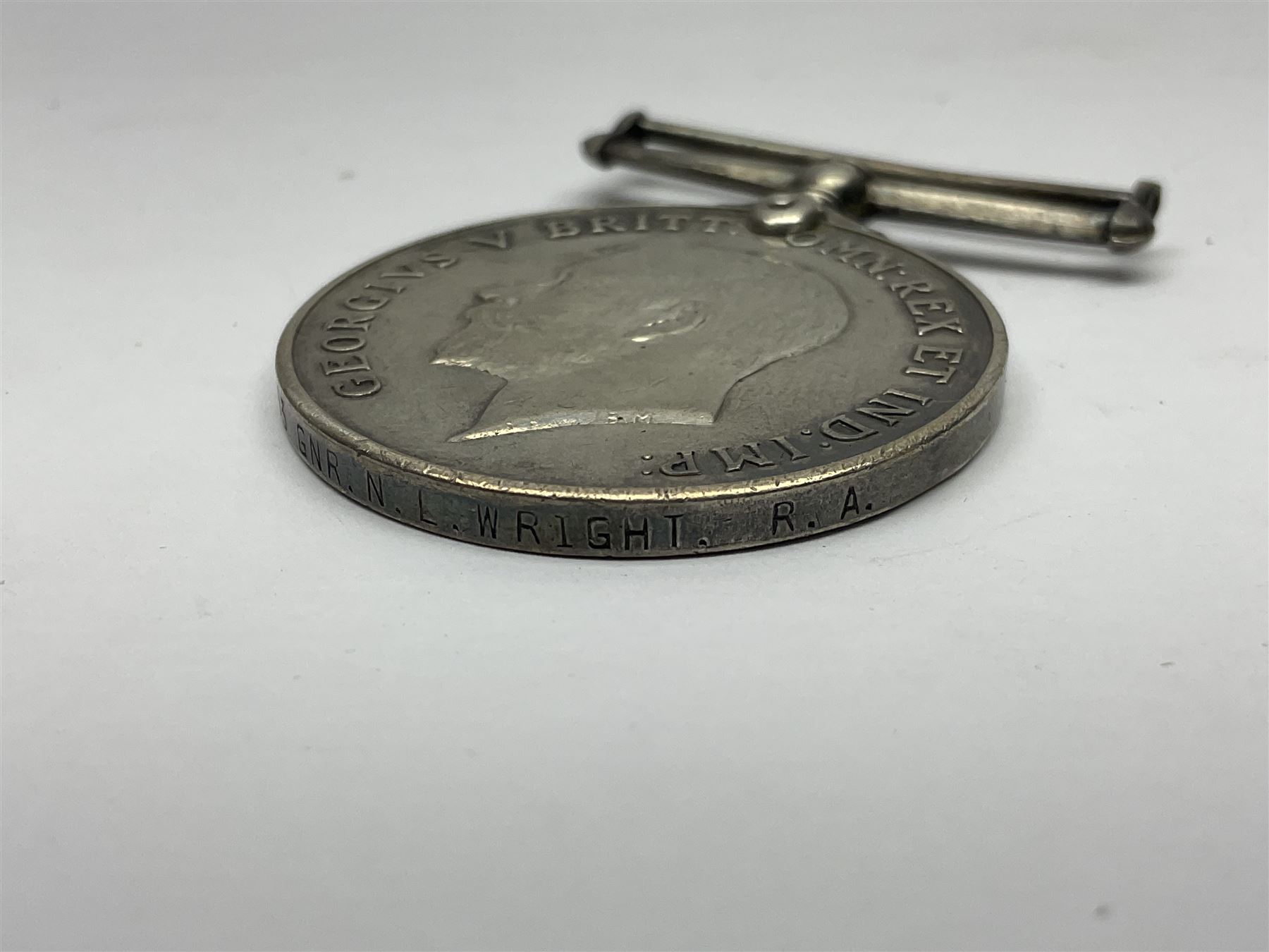 WWI J. Hudson & Co. Birmingham trench whistle dated 1916; WWI British War Medal awarded to 117363 Gnr. N.L. Wright R.A.; Services Rendered badge No.111643; RAF & RFC cap badges etc