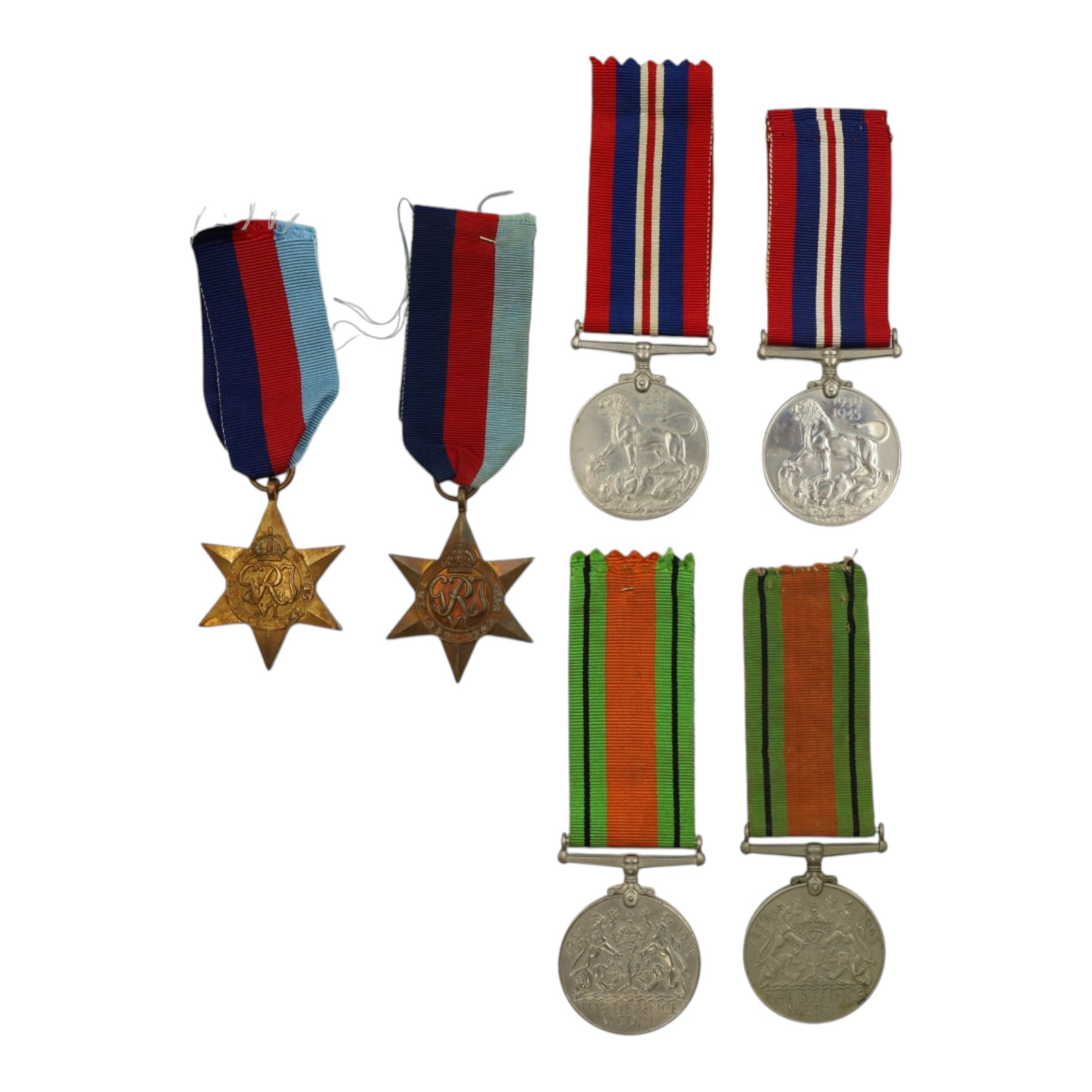 WWII British medals comparing two War medals, two defence medals and two 1939-45 Stars  