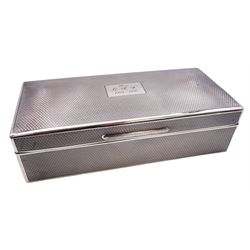 1920's silver mounted cigarette box, of rectangular form with engine turned decoration to the exterior, the hinged cover with central rectangular panel engraved with initials and date opening to reveal a soft wood lined interior, hallmarked 	William Comyns & Sons Ltd, London 1929, H5cm W19cm D8.5cm