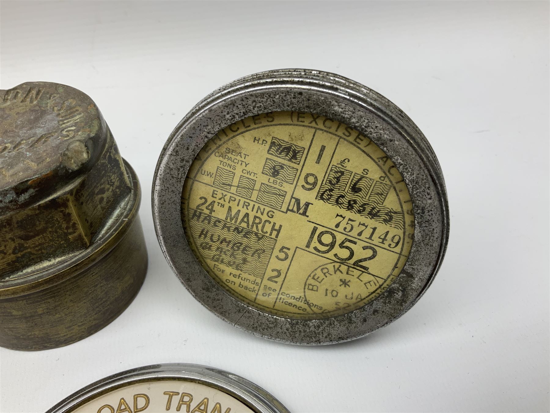 Three brass cart wheel hub caps for W. Johnson & Son Builders Hull, another for W. Harrison Builder Hull, copper printing plate for Hull & Barnsley Railway Timetable, two Hull & District Road Transport Training Group Advanced Driver car badges and framed 1952 car road task disc (8)  