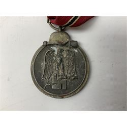 WW2 German Eastern Front Medal awarded to those who served on the German Eastern/Russian Front during the Winter Campaign period of 15th November 1941 to 15th April 1942 with original ribbon; and German War Merit Cross with swords 2nd Class (2)