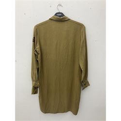 1930s Hitler Youth brown shirt, long length with two pockets, bears triangular badge 'Nord Nordsee'