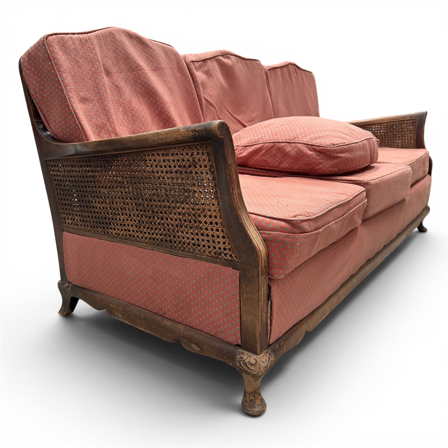 Early 20th century French style bergère conservatory suite, canework back and sides with red upholstered loose seat cushions, on cabriole feet