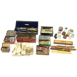 A selection of various writing accessories, to include a cased drawing instruments set, containging various dividers, compasses, and a folding rule, the case makred Cary Porter Ltd 7 Pall Mall London, a quantity of pen nibs, assorted inkwells, rubbers, and pens, etc., together with a selection of approximately forty postcards, to include a silk example. 