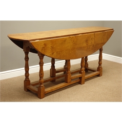  18th century style light oak wake table, oval drop leaf top, on gate leg action base with turned supports, W183cm x D105cm, H76cm  