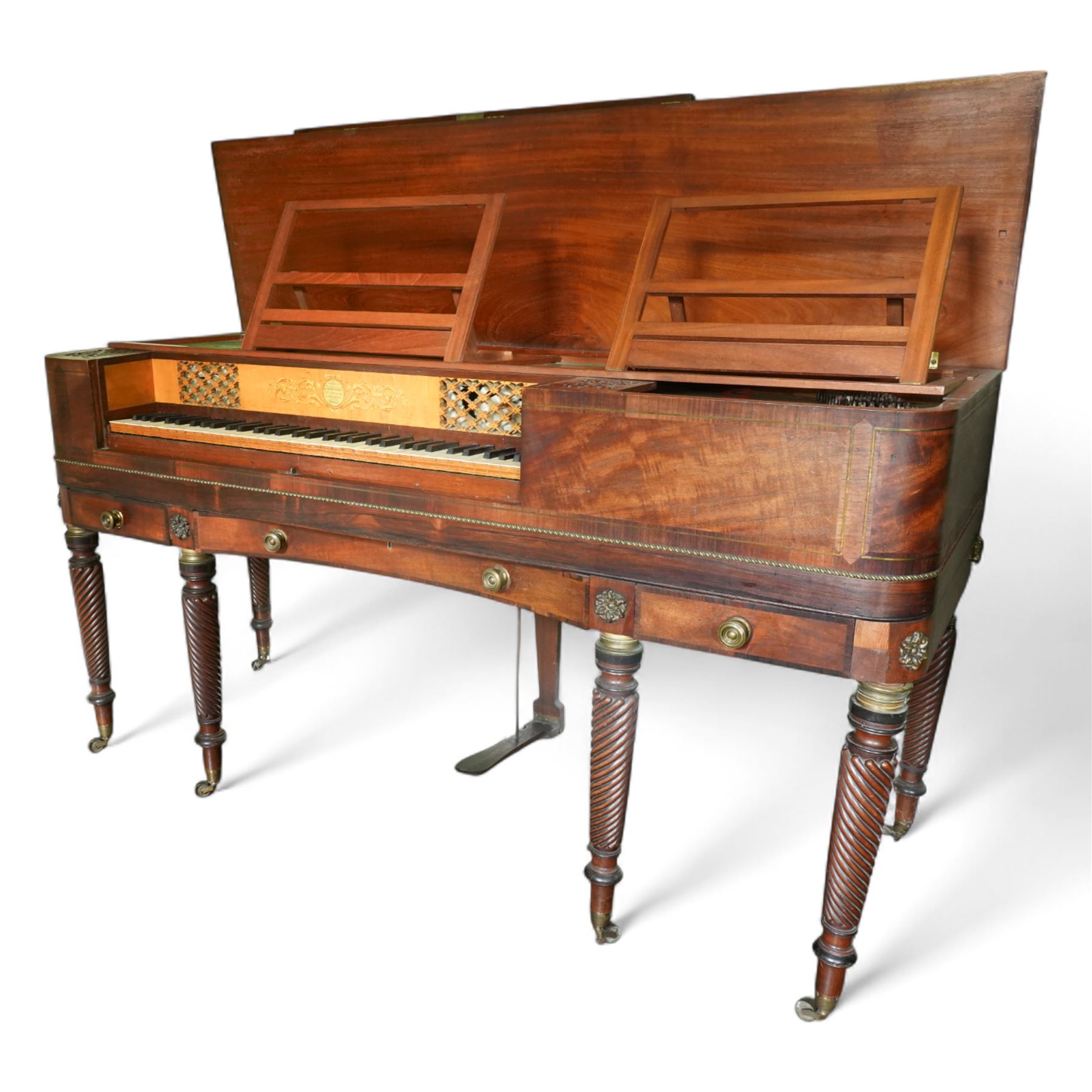 Early 19th century George IV Square Piano by William Rolfe & Co, 112 Cheapside, London, c1821. Mahogany veneered case with rosewood crossbanding and brass stringing, with sustain pedal and reeded legs on a tapered spiral with brass capitals, with three music draws beneath and a folding duet music stand, nameboard with makers name on a round gilt medallion and open silk backed fretwork to the ends, serial No 6699, double strung, English double action with 68 ivory and ebony keys, F1-C7. original strings, hammers and dampers, soundboard and bridge in good condition, with original makers written instructions on regulating the action and tuning the piano attached to the inside of the instrument. In good condition, however the action is in need of regulation and tuning.
William Rolfe is thought to have been in business between 1785 and 1828. 
Given the intricate nature of these historic instruments, specialist support will be available if required, to assist successful buyers with safe removal and onward handling. Price upon application.


This item has been registered for sale under section 10 of the APHA Ivory Act Reference PB6GL6SZ