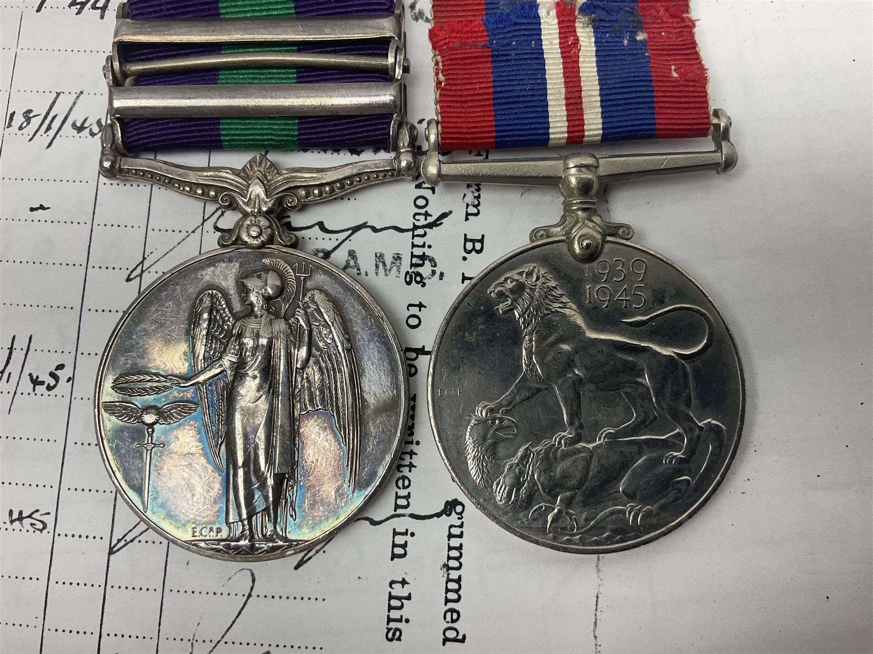 George VI General Service Medal with two clasps for Palestine 1945-48 and Cyprus and MID oak leaf awarded to 14887162 Sjt. C.F.A. Lloyd R.A.M.C. together with WW2 War Medal 1939-1945; both with ribbons; and quantity of photocopied research material including Army Records and London Gazette