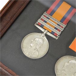 Victorian Queens South Africa Medal with Belfast Orange Free State and Cape Colony clasps, Kings South Africa medal, awarded to 72 Pte W Wilson Scots Gds and WWI war medal and 1914 star, awarded to 9335 Pte W Neilson S Gds, all framed with Scots Guard Beret badge to the centre 