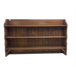 Oak three heights open bookcase, shaped end supports and plank back