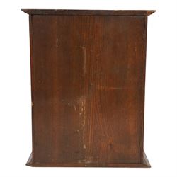 Oak smoking cabinet, with hinged lid, the glazed door opening to reveal a fitted interior, over a single drawer, together with a wooden tobacco box with lid, cabinet H39cm
