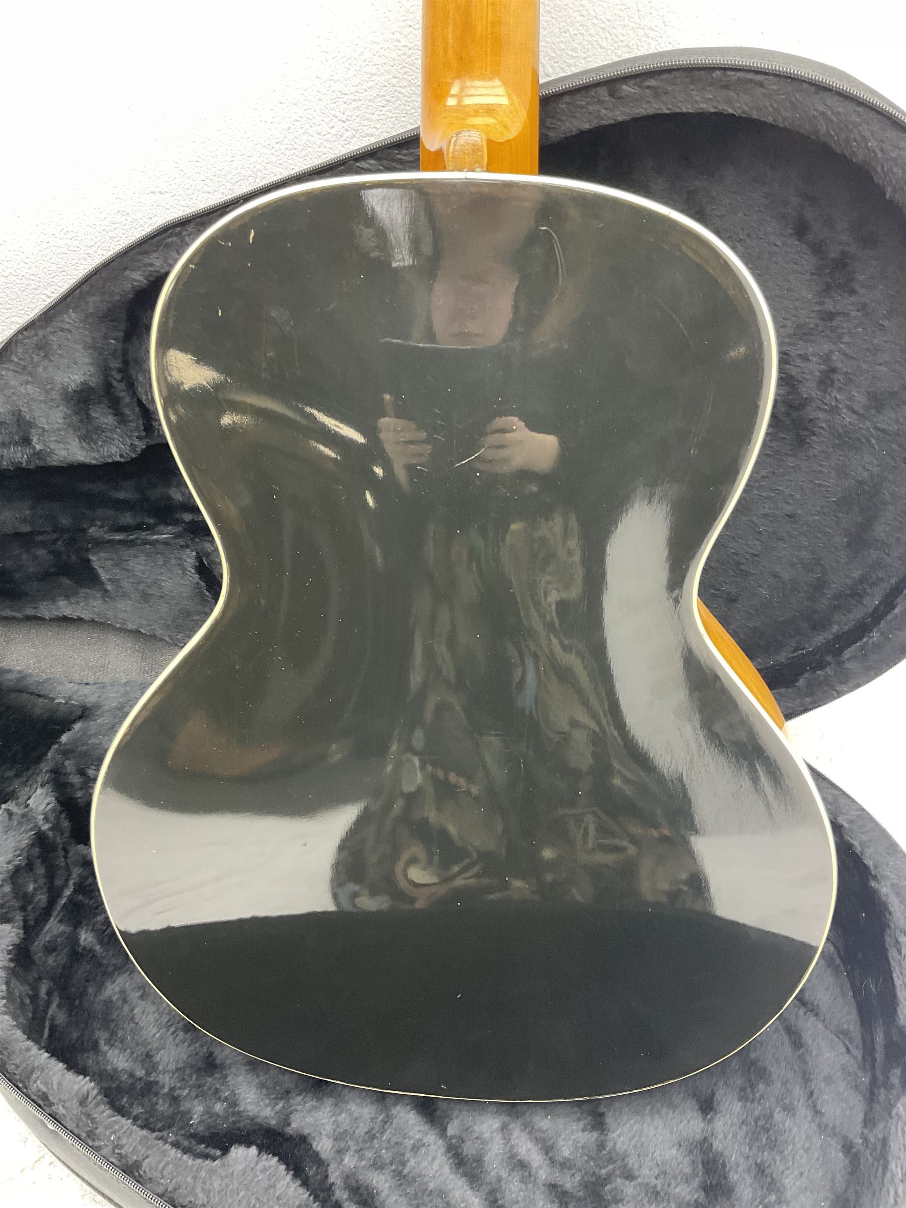 1950s acoustic guitar with f-holes and pickguard L105cm; black fur lined hard carrying case