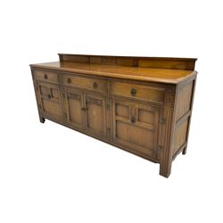 Mid-20th century oak dresser, fitted with three drawers and four cupboards