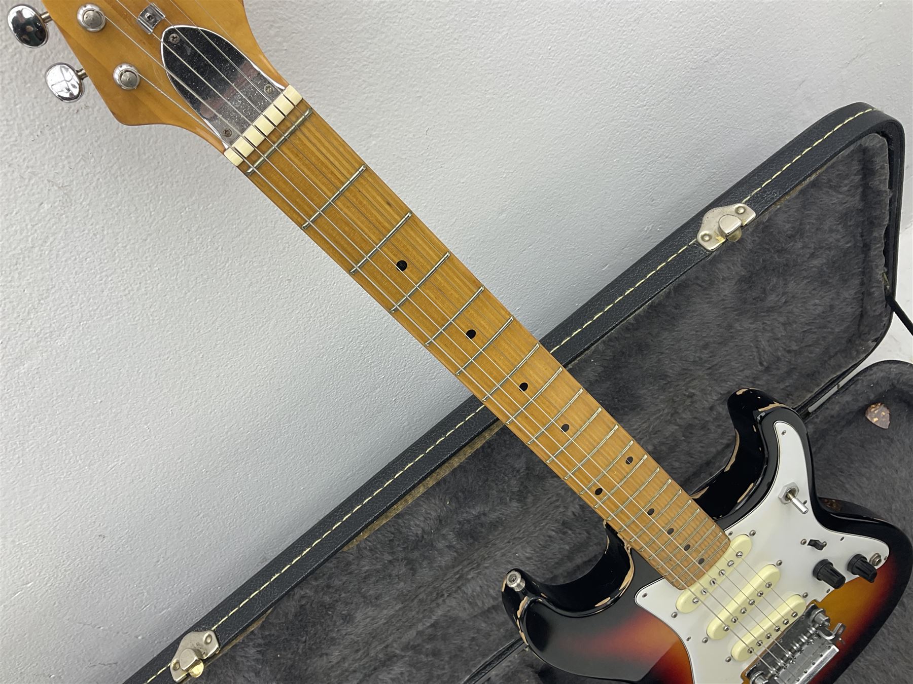 Fender style sunburst electric guitar with manuscript mark 'Zenta Stratocaster 1963' L97cm; in hard carrying case; another similar unmarked sunburst electric guitar; in gig bag; and Fender Frontman Amplifier, serial no.M473406 (3)