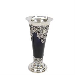 Two late Victorian silver mounted vases, including blue glass mounted example with fluted rim and upon circular foot, hallmarked Henry Matthews, Chester 1900 and a tapering example with fluted rim and pierced embossed scroll decoration to body, with blue glass liner, hallmarked James Deakin & Sons, Chester 1897, tallest H18.5cm