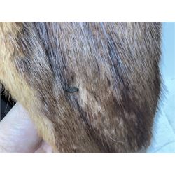 Brown mid length musquash fur coat by National Fur Company together with white rabbit cape