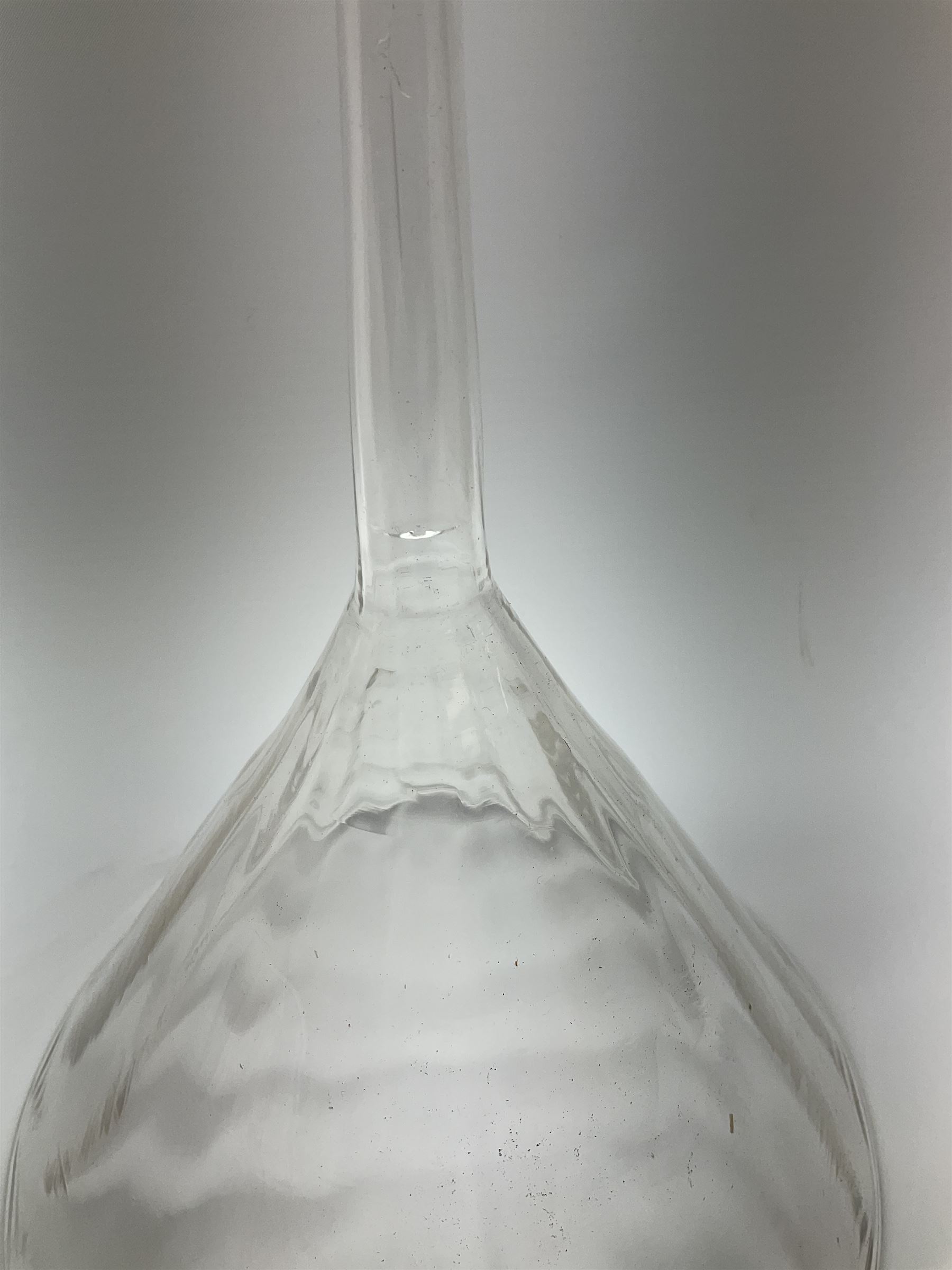 Collection of 19th century and later pharmaceutical laboratory glass, to include, large filter funnel, graham condenser, conical flask, bell jar and another with graduated tube, Provenance: discovered in the storeroom of a long established Hull pharmacist and opticians