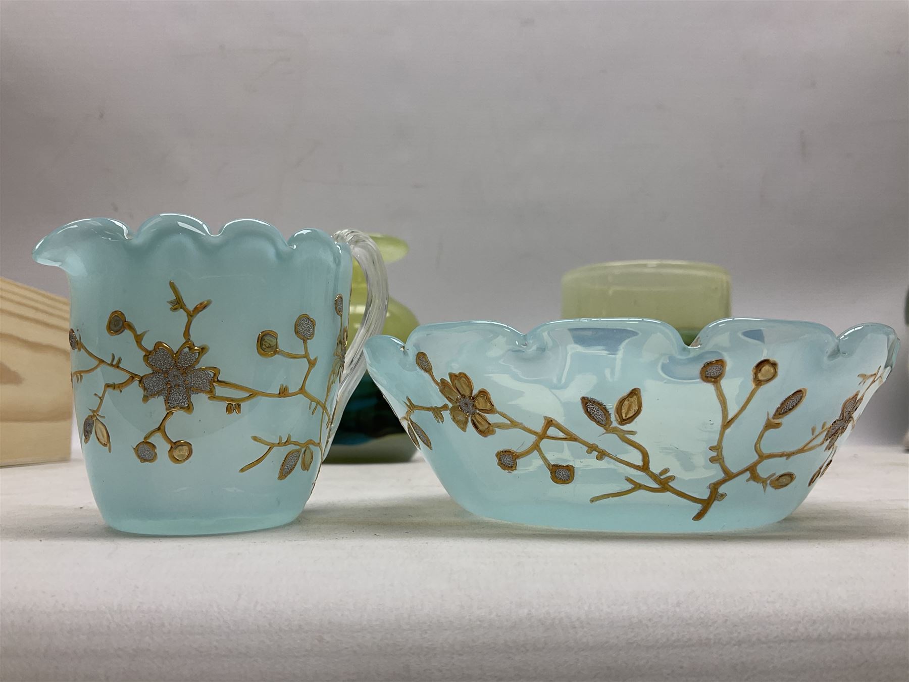 Mdina sea and sand glass vase, of cylindrical form, decorated in green, turquoise and brown, and matching vase, both unmarked together with a glass bowl and jug with gilt decoration 