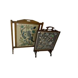 Mid-20th century oak fire screen with crewelwork panel with floral and animal designs (88cm x 69cm), and mid-20th century mahogany fire screen with shaped pediment and crewelwork panel depicting wild flowers (83cm x 57cm)
