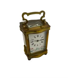 A French dauphine cased carriage clock c1890, four bevelled glass panels and a rectangular glass to the top, with a white enamel dial with Roman numerals, minute markers and steel spade hands, with painted decoration beneath, eight-day movement with a replacement lever platform escapement.



