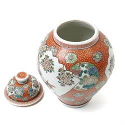Japanese vase and cover decorated with panels of exotic birds in a fenced garden setting on orange and gilt scroll ground marked Zoshuntei Sanpo Zu H30cm